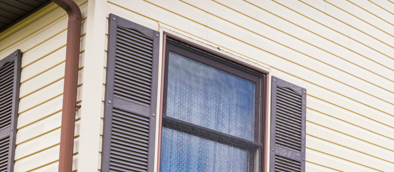 Why Vinyl Siding Starts To Warp, Crack, or Fade Over Time